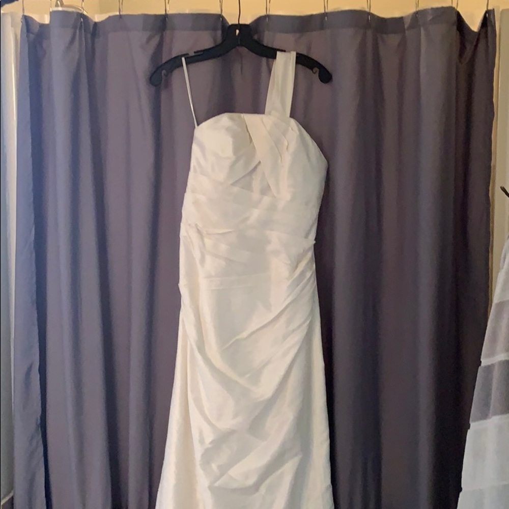 Wedding dress size four new with tags